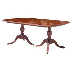 an old wooden table with two legs on each end and one leg raised up to the top