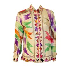 This is an extremely RARE vintage blouse from Emilio Pucci. This blouse has a quite amazing print on silk of ladies dancing with ribbons. His signature can be found in various places on the blouse, including the front and cuffs. There are 2 spare buttons included on the inside inside seam. Please review the measurements provided to ensure a perfect fit. Measurements: Labeled as a size 12 Length: 26" Shoulder to Shoulder: 16" Sleeve:24" Bust: 38" Pucci Scarf, White Silk Top, Pucci Vintage, White Silk Blouse, 60s 70s Fashion, Expensive Clothes, Lovely Clothes, White Silk, Front View