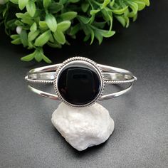 Black Cuff Bracelet Gift, Black Cuff Bracelet As Gift, Adjustable Black Cuff Bangle, Classic Black Cuff Bracelet Bangle, Classic Black Cuff Bracelet In Bangle Style, Formal Black Cuff Bracelet With Polished Finish, Polished Black Bracelets, Classic Black Bangle As Gift, Black Polished Cuff Bracelet For Formal Occasions