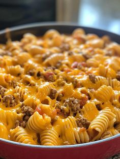 a casserole dish with cheese and ground beef