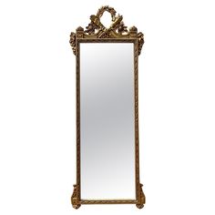 an ornate gold framed mirror against a white background