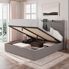 a bed with a pull out mattress underneath it