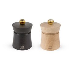 two wooden salt and pepper shakers one black, the other wood with gold knobs