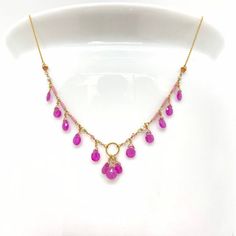 Wire, Chain & Clasp: 14k GoldStones: Pink Sapphires (approx. 3.5mm), Freshwater Pearls (approx. 1mm x 2mm), 18k Gold Daisy (approx. 2mm), 18k Gold Loop (approx. 5mm)Beads: Antique Italian Glass (approx. 1mm)Necklace Length: approx. 17”Backdrop: Sapphire & Antique Italian BeadsBackdrop Length: 1.6”——————————————————————————————Let me know if you have any questions!*Size adjustable at client’s request_________________________________________________693 Luxury Pink Briolette Necklace, Fine Jewelry In Yellow Gold With Faceted Beads, Yellow Gold Briolette Gemstone Bead Jewelry, Yellow Gold Briolette Necklaces With Faceted Beads, Briolette Beaded Chain For Jewelry Making, Yellow Gold Briolette Necklace With Faceted Beads, Pink Gemstone Necklace, Pink Gemstones, Gold Chain Necklace