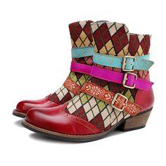 Make an artistic style statement in this durable leather ankle boot embellished with a crisscross buckle strap at the ankle and a vibrant mix of patterns and colors. 2'' heel 10.2 Shaft Zip closure Leather upper Leather lining Rubber sole Red Bohemian Boots For Fall, Multicolor Leather Ankle Moto Boots, Multicolor Leather Moto Ankle Boots, Bohemian Moto Boots With Round Toe, Multicolor Leather Moto Boots For Fall, Vintage Multicolor Boots For Fall, Multicolor Leather Moto Boots With Round Toe, Bohemian Red Leather Boots, Bohemian Boots