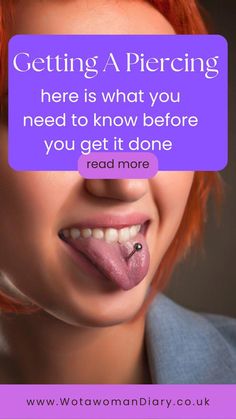 a woman with red hair is smiling and has her tongue sticking out to the side