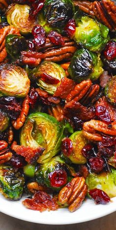 brussel sprouts with pecans and cranberries in a white bowl