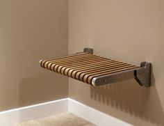 a towel rack mounted to the side of a wall