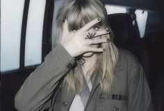 a woman covering her face with both hands