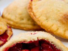 some pies are sitting on a white plate