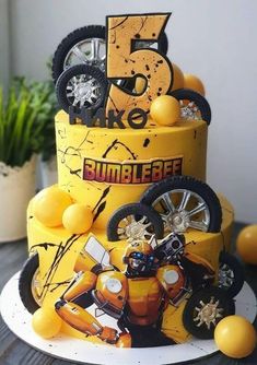 a three tiered cake decorated with an image of a bumblebee on it