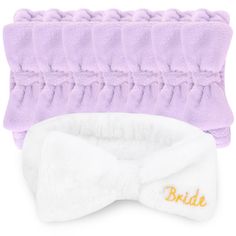 two purple and white headbands with the word bride on them, one has a bow