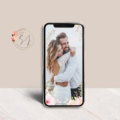 a phone case with an image of a man and woman hugging each other in front of a marble background