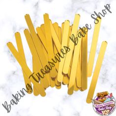 yellow plastic straws are stacked on top of each other with the words bakeware treasures sale above them