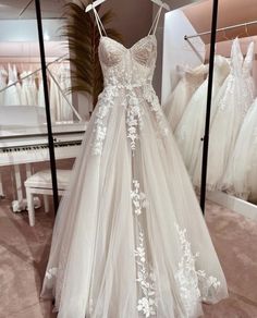 a wedding dress is on display in a store