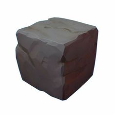 a large rock sitting on top of a white surface