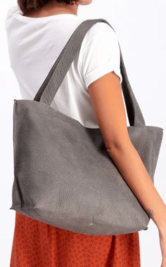 ▼Designer Tote Bag | Shiri Tote This Designer Tote Bag is perfect for any stylish woman! It's made from the finest full grain high-quality Italian leather, and comes in various colors to match your personal style.The spacious interior of this tote will protect all of your essentials. Plus it features two pockets inside to keep everything secure no matter what it is!A designer tote bag is the perfect everyday bag! It's big enough to fit everything you need, but not so much that carrying it around Designer Totes, Daily Tasks, Bag Handmade, Daily Essentials, Everyday Bag, Womens Tote, Tote Bag Design, Leather Purse, Grey Leather