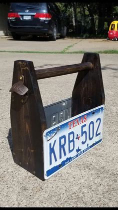 a license plate holder made out of wood