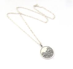 "Sterling Silver Etched Wave Necklace. Retirement Gift for Women This is a great gift for the women who loves the ocean and is hoping to spend more time there when she retires! It is also a great everyday necklace that you will enjoy wearing. Beautiful and unique etched ocean waves charm hanging from a nice quality sterling silver chain and finished with a sturdy lobster clasp. The findings are all sterling silver. Choose your desired length from the drop down menu, 16, 18 or 20 inches. The char Adjustable Engraved Necklaces For Beach, Adjustable Engraved Necklaces For The Beach, Engraved Pendant Necklace For Beach, Beach Engraved Pendant Jewelry, Beach Pendant Jewelry With Engraving, Ocean Color Pendant Necklace As Gift, Retirement Gifts For Women, Wave Necklace, Everyday Necklace