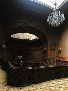 an ornately decorated room with chandelier and windows