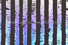 an abstract photograph of trees with purple and blue colors