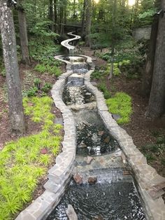 a long stone path with water running through it