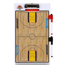 a clipboard with a basketball court on it and marker pens in front of it