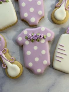 decorated cookies in the shape of baby ones