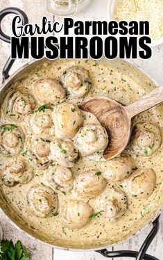 garlic parmesan mushrooms in a skillet with a wooden spoon on the side