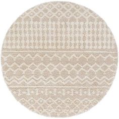 a round rug with white and beige patterns