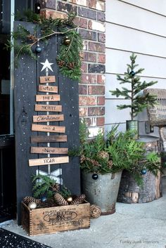 christmas decorations are displayed on the front porch