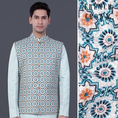 hidden Blue Floral Embroidered Bandhgala For Designer Wear, Festive Blue Bandhgala With Floral Embroidery, Blue Bollywood Nehru Jacket With Intricate Embroidery, Designer Blue Nehru Jacket For Diwali, Fitted Blue Embroidered Nehru Jacket, Blue Bollywood Bandhgala With Floral Embroidery, Blue Long Sleeve Bandhgala For Spring, Designer Blue Nehru Jacket With Intricate Embroidery, Designer Blue Nehru Jacket With Zari Work