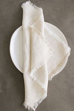 a white plate with a napkin on it