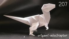 an origami dinosaur is shown on a black background with the year 2017 written below it