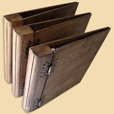 three wooden folders sitting next to each other