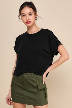 You'll be looking calm and collected all day long in the Lulus Cool Instincts Black Short Sleeve Top! Sleek and stretchy jersey knit shapes this classic tee that has a crew neckline and short, dolman-style sleeves. The relaxed, wide-cut bodice falls to a slightly cropped hem, perfect for pairing with your favorite high-waisted denim. Fit: This garment fits true to size. Length: Size medium measures 19.75" from shoulder to hem. Bust: Great for any cup size. Waist: Not Fitted - comfortable room th Boxy Solid Color Crew Neck Top, Boxy Crew Neck Top For Layering, Versatile Top With Ribbed Crew Neck, Versatile Relaxed Fit Crew Neck Knit Top, Relaxed Fit Solid Color Crew Neck Knit Top, Relaxed Fit Crew Neck Knit Top, Solid Color Crew Neck Knit Top With Relaxed Fit, Cut Tshirt, Knit Tees