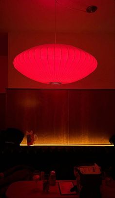 a large red light hanging from the ceiling