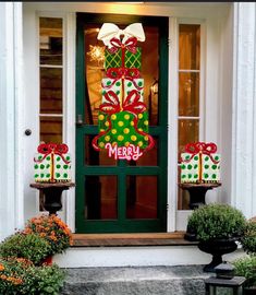 a decorated christmas door with presents on it