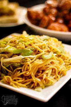 a white plate topped with noodles and vegetables