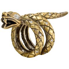 This statement ring was created in New York City by our expert goldsmiths. The design was inspired by Mary Queen of Scots, cousin to Elizabeth I. Elizabeth's advisors referred to Mary as "the bosom serpent" -- close to the queen of England, and dangerous. A bold look comfortable enough to wear every day. 18K yellow gold totaling 30.98 grams, satin finish. Two marquise diamonds totaling 3 points. Accent diamonds totaling 2 points. 2 1/8 in. long. Made in New York City. Queen Of Scots, Marquise Diamond Ring, Chic Rings, Vintage Cocktail Ring, Round Diamond Setting, Family Jewels, Snake Jewelry, Diamond Eyes, White Diamond Ring