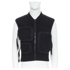 Runway LOUS VUITTON Virgil Abloh Multi 3D Pocket utility pocket ribbed vest M Reference: JHVC/A00010 Brand: Louis Vuitton Designer: Virgil Abloh Collection: Runway As seen on: Virgil Abloh Material: Polyamide, Cotton Color: Black Pattern: Solid Closure: Zip Extra Details: Multi 3D pockets. Ribbed knit upper. Zip front closure. Made in: Italy CONDITION: Condition: Excellent, this item was pre-owned and is in excellent condition. Brand label semi detached. Remarks: There is a marking on the brand 3d Pocket, Utility Vest, Belted Cardigan, Cardigan Sweater Coat, Louis Vuitton Designer, One Clothing, Louis Vuitton Men, Vintage Louis Vuitton, Semi Detached