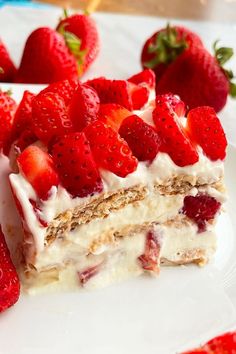 there is a piece of cake with strawberries on it