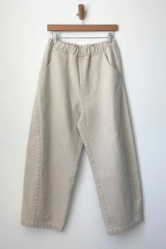 The Arc Pants practically beg to be lived in! With a comfy elastic, high waist and slightly curved leg shape, the cropped length shows off sneakers or sandals. Unique side panels and deep pockets keep things simple. The heavy-weight canvas material gives these pants structure and longevity. Plus they'll be the perfect complement to your Le Bon Shoppe socks!Please note: The dying and washing process gives each garment unique character, allow for slight color variation for each garment as is the b Shoes Unique, Side Panels, Panel Siding, Canvas Material, American Vintage, Cotton Yarn, Trousers Women, Design Details, High Waist