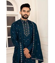 *PRODUCT DETAILS:- Elevate your ethnic wear collection with this stunning men's rama Roman silk kurta with dupatta by Siya Swayamvar. This readymade kurta boasts intricate heavy embroidery work, adding a touch of luxury and sophistication to your look. Made from smooth and comfortable Roman silk, this kurta is perfect for any special occasion, from weddings and parties to ceremonies and casual gatherings. *Key Features:- No of Components: 3 Components: Kurta, Stole ,dhoti/patiyala Pattern: Embroidered Type of Work: Thread, sequins Neckline: Mandarin Collar Sleeve Type: Full Fabric: Silk Color: Maroon Occasion: Sangeet, Cocktail party ,wedding & Reception Care: Dry clean only Disclaimer Text: Product color may slightly vary due to photographic lighting sources or your monitor/screen setting Dhoti Patiyala, Cocktail Party Wedding Reception, Kurta With Dupatta, Embroidery Kurta, Silk Kurta, Heavy Embroidery, Fantasy Costumes, Silk Embroidery, Blue Silk