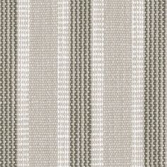 an upholstered striped fabric with grey and white stripes