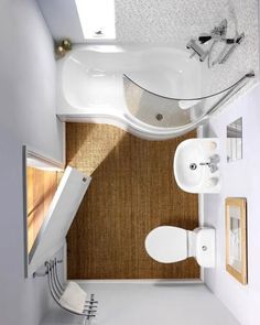 an overhead view of a bathroom with sink, toilet and bathtub