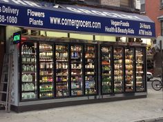 a grocery store with many different types of foods and drinks in it's windows