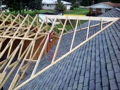 a roof that is being built with wooden framing