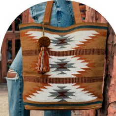 Embrace the vibrancy of our Brown, Rust, Teal & Cream Aztec Tote, a stunning blend of colors and practicality. Stand out with the multicolored pom tassel detail that adds a playful touch to this stylish tote, complemented by durable leather straps for a chic finish. Generously sized at 16" x 6" x 17", this tote is not only a fashion statement but also a spacious companion for your everyday essentials. Crafted from 100% cotton, this Aztec-inspired tote ensures both durability and a touch of luxur Brown Tasseled Bags For Shopping, Brown Tassel Bags For Shopping, Brown Shopping Bags With Tassels, Bohemian Tote Bag With Tassels, Brown Tassel Tote Shoulder Bag, Everyday Tote Bag With Tassels, Trendy Multicolor Fringe Bag, Casual Tote Shoulder Bag With Tassels, Tote Shoulder Bag With Tassels For Shopping