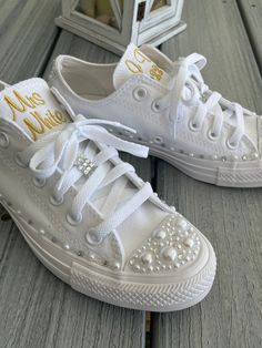 Getting Married? What a great idea. Let's add some PEARLS and BLING to your day. How pretty are these?! You can do them: With or without the date. With or without the monogram. ie Mrs. Smith or a monogram on each shoe Wear these at your reception so your feet don't hurt. You can do white to match your dress or coordinate with your bridal party. You can even get each person in your bridal party a pair. What a great gift !! Hi tops with pearls are an additional fee and listing is in my shop. Half Ring Bearer Shoes, Monogram Converse, Bride Sneakers, Wedding Theme Color Schemes, Pearl Wedding Shoes, Wedding Converse, Wedding Sneakers, Custom Converse, Shoes Converse